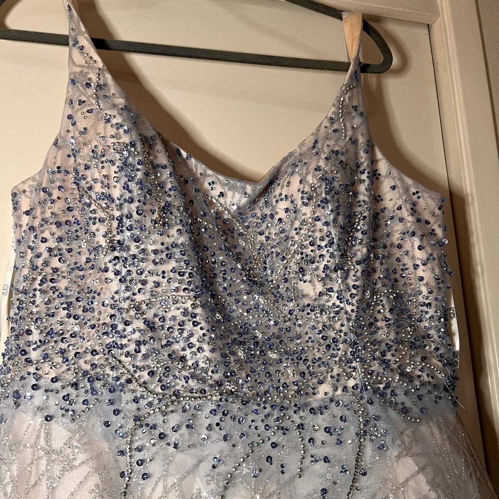 This ball gown is a size xl originally xxl made for a tall person. Worn one time